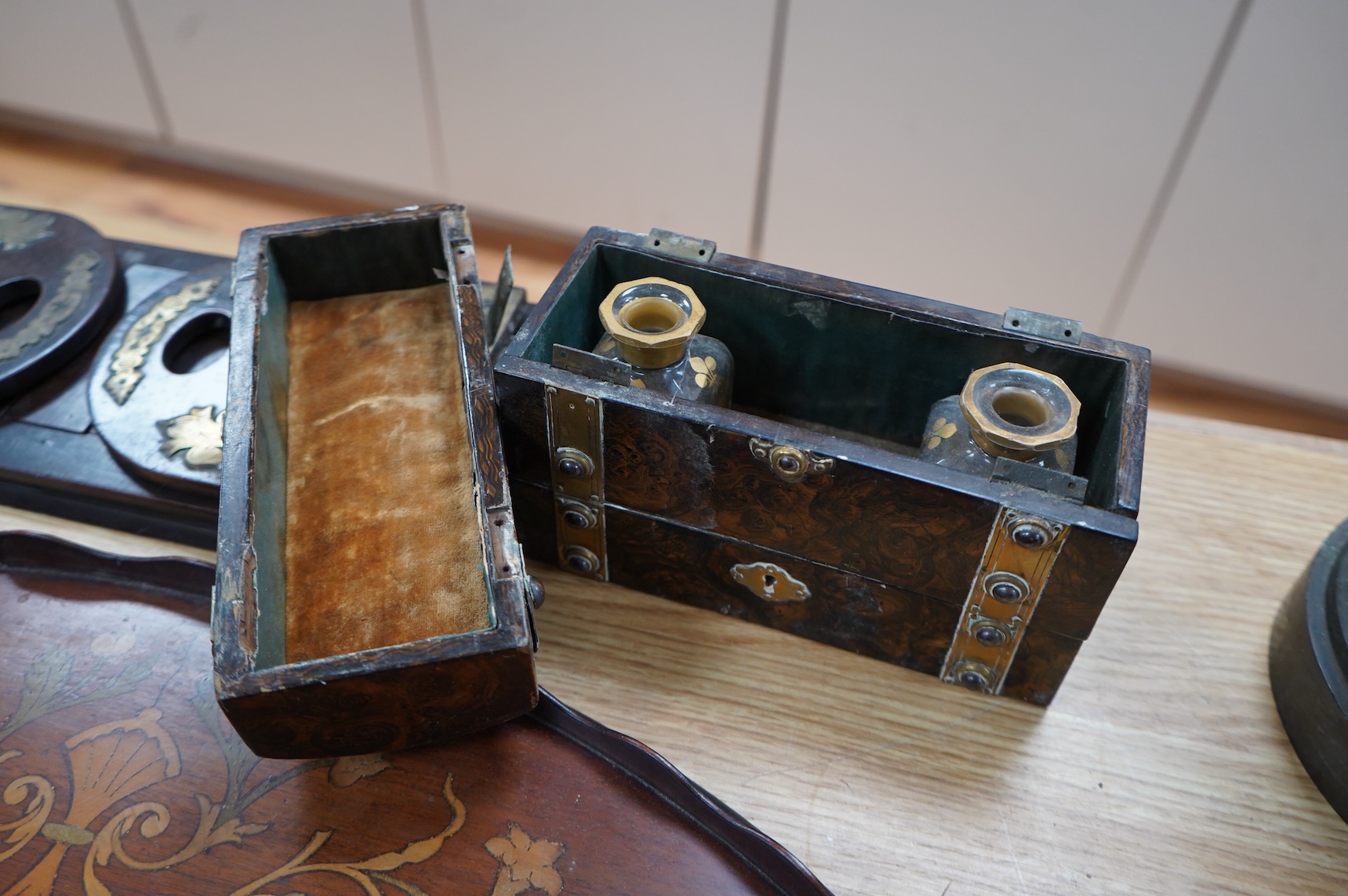 A Victorian domed scent bottle casket, two brass mounted book slides and a marquetry tray, 68cm